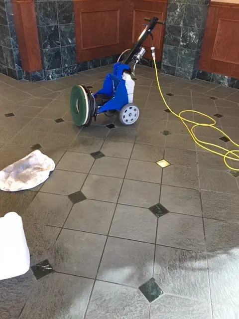 Our tile cleaning machines in Darwin, halfway through a tile cleaning service